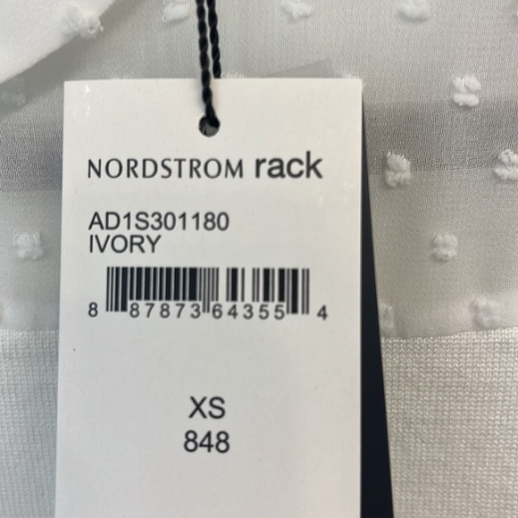 Lightweight sleeveless knit top with sheer accents around the collar. - Picture 2 of 5